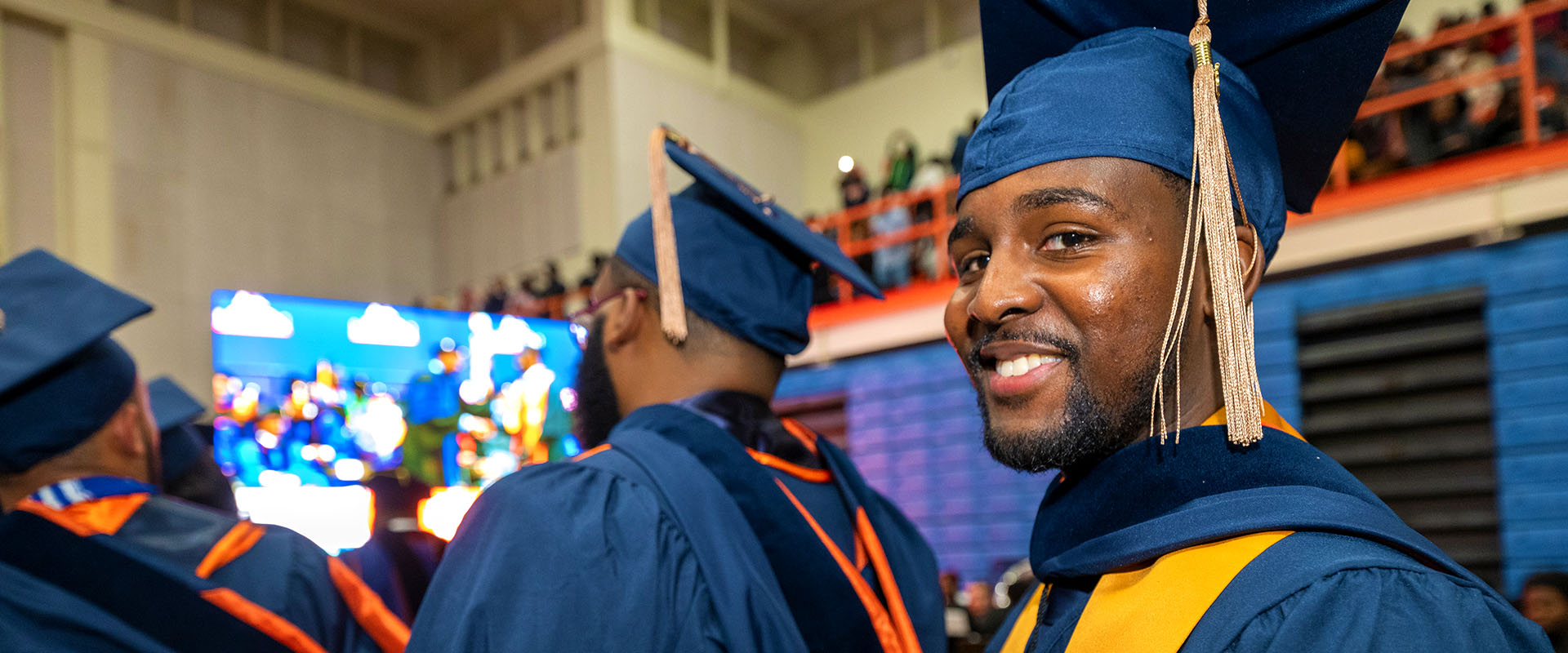 smiling male graduating student